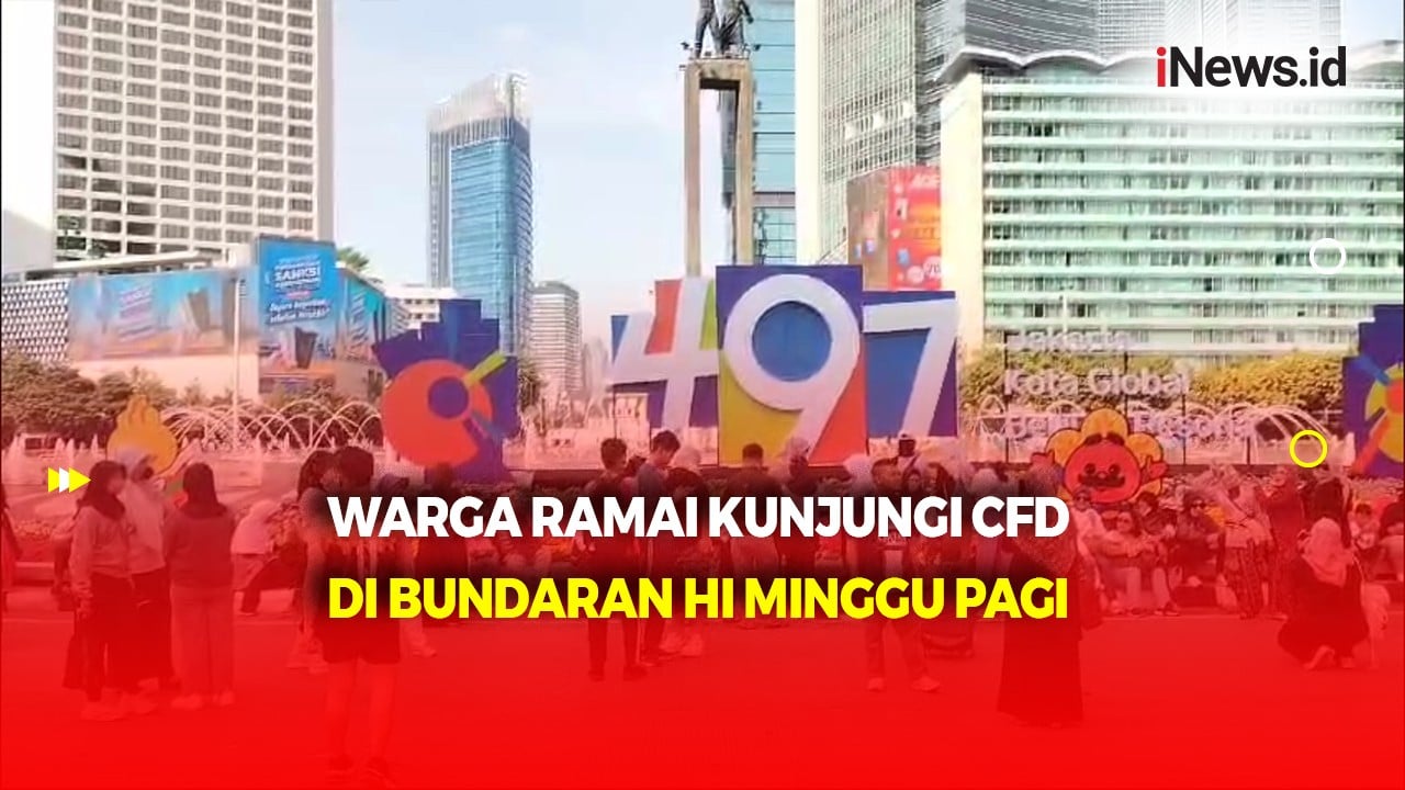 Menikmati Minggu Pagi di CFD Thamrin, Warga Abadikan Momen Depan Logo HUT ke-497 Kota Jakarta 