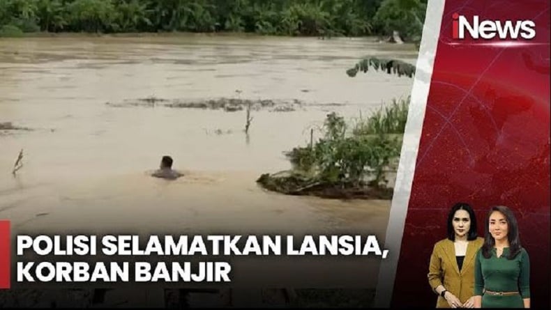 Mendebarkan! Aksi Heroik Polisi Selamatkan Lansia Terjebak Banjir di Deliserdang