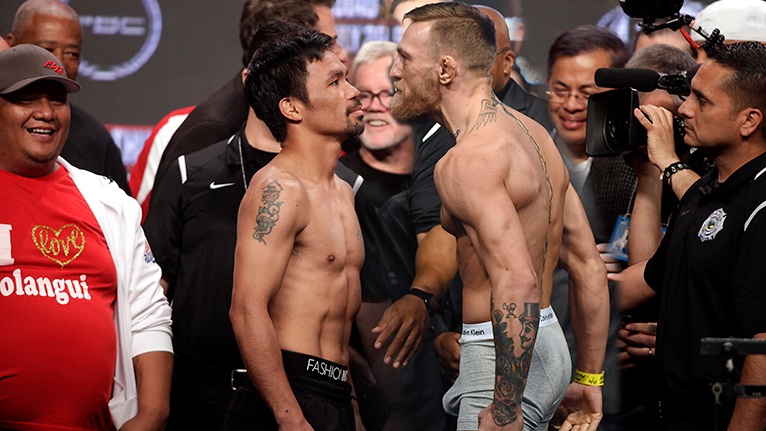 Conor McGregor Vs Manny Pacquiao Rencana duel petarung UFC Conor McGregor melawan petinju Manny Pacquiao sedang ramai diperbincangkan. Evander Holyfield kira-kira dukung siapa ya? (Foto: Boxing News)