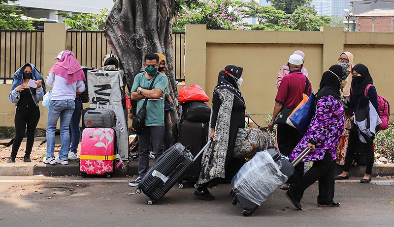 Pelaku perjalanan luar negeri hendak menjalani karantina Covid-19 di Rusun Pasar Rumput. (Foto MNC Portal).