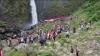 Personel Gabungan di Asahan Kibarkan 75 Bendera Merah Putih di Bawah Air Terjun Ponot