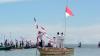 Berdiri di Atas Perahu, Warga Kampung Arar Sorong Upacara Bendera di Tengah Laut