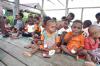 Aksi Sosial Wafer Tango Bagikan Telur Rebus ke Anak-anak Papua - Bagian 3
