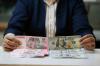 Rupiah Tembus Rp17.409 per Dolar AS - Bagian 3