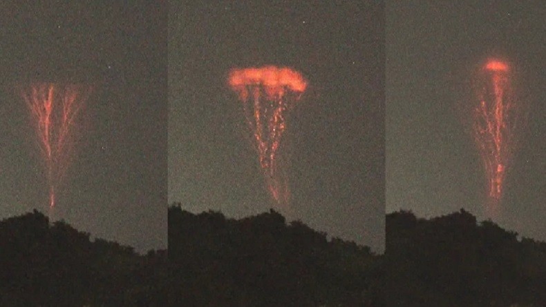 Ngerinya Petir Terbalik yang Diabadikan Fotografer, Keluar dari Awan Badai dengan Warna Merah Menyala
