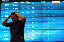 IHSG Tergelincir ke Zona Merah, Rupiah Parkir di Rp14.141 per Dolar AS