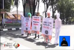 Sosialisasi Gerakan Antigolput, Peserta Kenakan Pakaian Pocong ke Jalan 