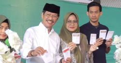Cagub Sulsel Ichsan Yasin Limpo Bersama Keluarga Mencoblos di TPS 24<