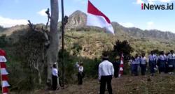 Video Warga dan Satgas Yonmek 741 Kibarkan Bendera Merah Putih di Bukit Nainaban