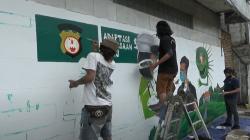 Ingatkan Protokol Kesehatan, Komunitas Mural Medan Lukis Dinding di Jalan Kereta Api<