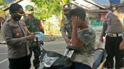 Bersinergi Cegah Covid-19, Polres Boltim dan Kodim 1303 Bagikan Masker ke Warga