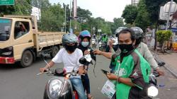 Terdepan dalam Protokol Kesehatan, Mitra Gojek Serang Raya Bagikan Masker dan Edukasi Masyarakat<