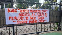 Antisipasi Covid-19, Petugas Tandai Rumah Pemudik yang Baru Tiba di Jakarta