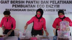Bhayangkari Sulut Bersih-Bersih dan Berikan Pelatihan Pembuatan Eco Enzyme di Pantai Walet Bitung