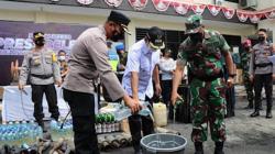 Jelang Nataru, Polres Bitung Musnahkan Barang Bukti Miras dan Knalpot Bising<