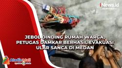 Jebol Dinding Rumah Warga, Petugas Damkar Berhasil Evakuasi Ular Sanca di Medan