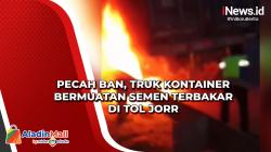Pecah Ban, Truk Kontainer Bermuatan Semen Terbakar di Tol JORR