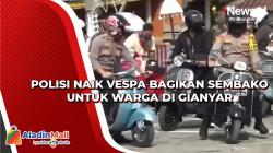 Polisi Naik Vespa Bagikan Sembako untuk Warga di Gianyar