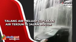 Talang Air Meluap Ciptakan Air Terjun di Jalan Bogor 
