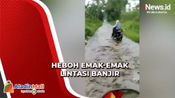 Bukannya Takut, Emak-Emak Lintasi Banjir Sambil Tertawa di Bondowoso