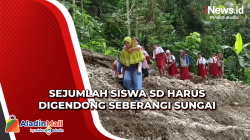 Jalan Tertutup Longsor, Sejumlah Siswa SD Harus Digendong Seberangi Sungai di Pacitan