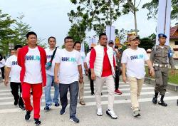 Bupati Pelalawan Hadiri Gerak Jalan Sehat Hari Ulang Tahun ke-25 Kementerian BUMN