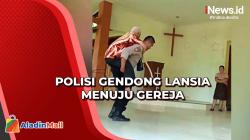 Momen Brigadir Polisi Gendong Jemaat Lansia Kebaktian Jumat Agung