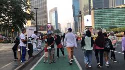 MNC Peduli Bersama Skrineer dan Ormas Oi BPW DKI Bagikan Masker ke Pengunjung CFD