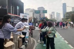 Cegah Polusi, MNC Peduli Bagikan 1 Juta Masker di CFD Jakarta