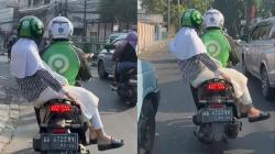 Viral Driver Ojol Bonceng Wanita dengan Cara Tak Biasa, Duduknya Salah Arah