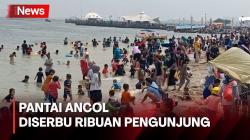 Menikmati Liburan Tahun Baru Ribuan Pengunjung Padati Pantai Ancol