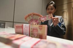 Rupiah Ditutup Melemah, Rp15.644 per Dolar AS Sore Ini 