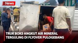 Diduga Kelebihan Muatan, Truk Boks Pengangkut Air Mineral Terguling di Flyover Pulogebang