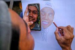 Potret Sang Pelukis Jalanan Mencari Rezeki
