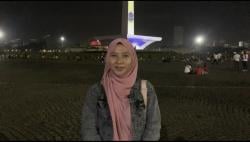 Antusiasnya Warga Sambut Tahun Baru di Monas meski Tanpa Kembang Api