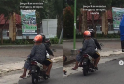 Dibonceng Sambil Bawa Payung, Posisi Helm Nenek-Nenek Bikin Ngakak Terpingkal