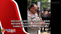 Amankan Demo Sambil Gendong Kucing, Aksi Kapolres Metro Bekasi Bikin Netizen Salut