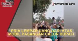 Heboh, Aksi Pria Bagikan Uang dari Mobil Bergambar Paslon Pilkada di Pandeglang Jadi Sorotan