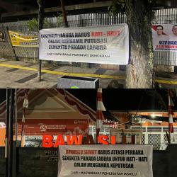 Masyarakat  Pasang Spanduk Aspirasi di Depan Kantor Bawaslu Sumut