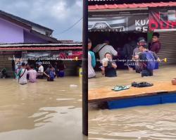 Viral! Warung Madura Ini Tetap Buka Meski Banjir Sudah Setengah Pinggang, Kapan Tutupnya?