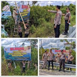 Satgas Bina Karuna Polda Kalteng Pasang Baliho Imbauan Cegah Karhutla di Jembatan Bukit Rawi