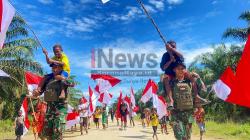 Semangat Merah Putih Membara di Perbatasan: TNI dan Warga Amyu Kibarkan Bendera Sambut HUT RI ke-80