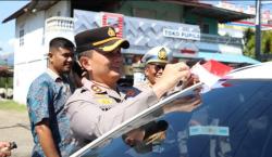Merah Putih Membanjiri Jalanan Meureudu! Polres Pidie Jaya Bagi 250 Bendera Semarakkan HUT RI ke-80