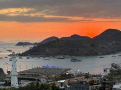 Labuan Bajo dan Pesan Wahyu: Antara Perempuan Berselubungkan Matahari dan Naga Merah