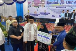 Wujudkan Jaring Pengaman, Ahli Waris Petugas Bilal Jenazah Terima Manfaat Rp42 Juta