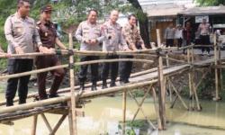 Polri Bangun Jembatan dan Tanam 1.000 Pohon Rambutan untuk Warga Tangerang