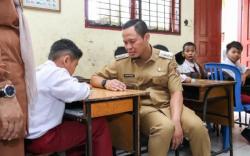 Menjamin Hak Kursi Sekolah untuk Anak Miskin dan Berprestasi di Pekanbaru tanpa Pungli