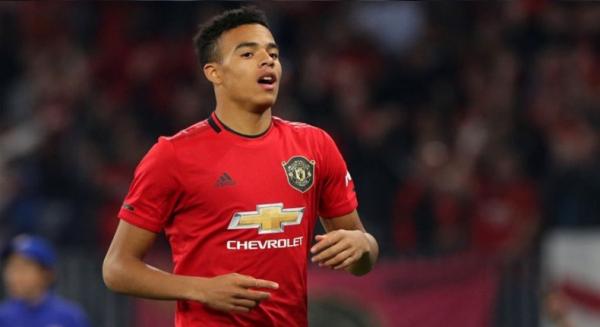 Penyerang Manchester United Mason Greenwood merayakan gol yang dibuatnya saat bermain imbang 1-1 melawan Everton, Minggu (15/12/2019). (Foto: AFP)