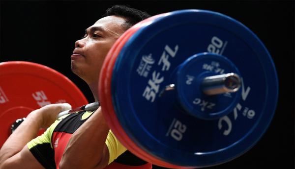 Eko Yuli Irawan - 1 Lifter Indonesia, Eko Yuli Irawan raih medali emas di SEA Games 2019 (Foto: AFP/Manan Vatsyayana)