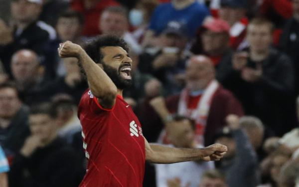 Mohamed Salah merayakan gol ke gawang AC Milan Winger Liverpool, Mohamed Salah merayakan gol ke gawang AC Milan dalam laga Liga Champions 2021/2022 di Stadion Anfield, Kamis (15/9/2021). (Foto: REUTERS/Phil Noble)